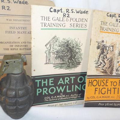 WW1 and WW2 Combat Training Books and a Display Grenade (Empty) est. $25 to$55.