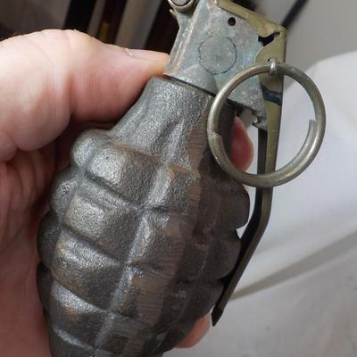 WW1 and WW2 Combat Training Books and a Display Grenade (Empty) est. $25 to$55.