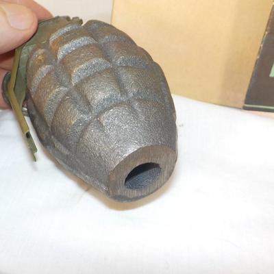 WW1 and WW2 Combat Training Books and a Display Grenade (Empty) est. $25 to$55.