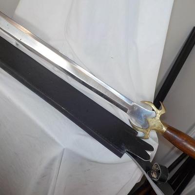 Swedish Armor sword approx. 26 in. with leather scabbard. est. $50 to $130..