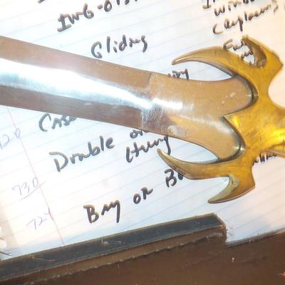 Swedish Armor sword approx. 26 in. with leather scabbard. est. $50 to $130..