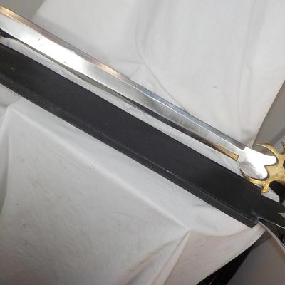 Swedish Armor sword approx. 26 in. with leather scabbard. est. $50 to $130..