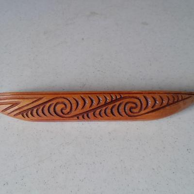 Wooden Carved in Rotorua New Zealand boat and Wood carved African statue