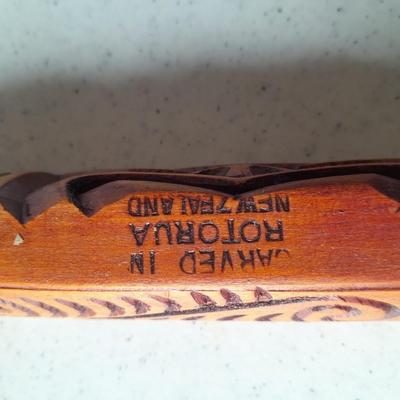 Wooden Carved in Rotorua New Zealand boat and Wood carved African statue