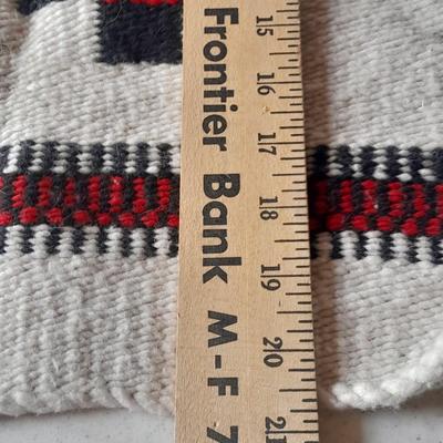 Pacific pottery vase with Native American print table throw.