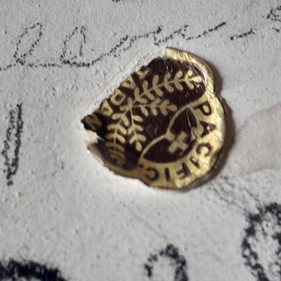 Pacific pottery vase with Native American print table throw.