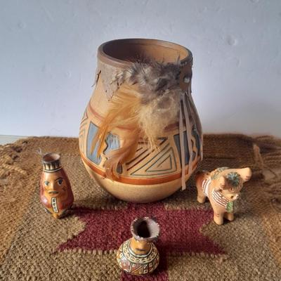 Pottery vase with pottery decor, and a woven Multi Color Durrie