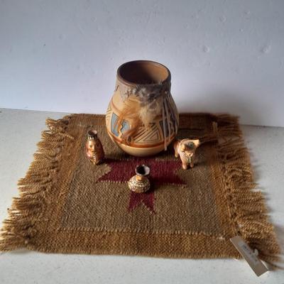 Pottery vase with pottery decor, and a woven Multi Color Durrie