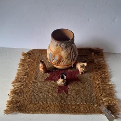 Pottery vase with pottery decor, and a woven Multi Color Durrie