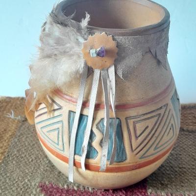 Pottery vase with pottery decor, and a woven Multi Color Durrie