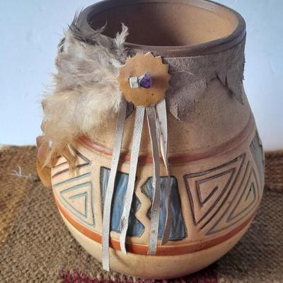 Pottery vase with pottery decor, and a woven Multi Color Durrie
