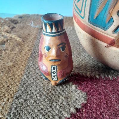 Pottery vase with pottery decor, and a woven Multi Color Durrie