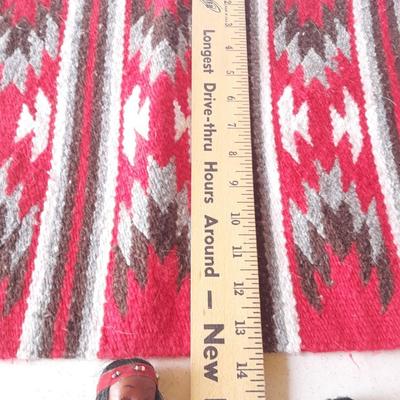 Signed pottery vase with Native dolls and Native. table throw rug