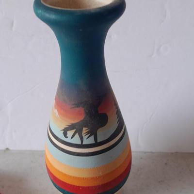Signed pottery vase with Native dolls and Native. table throw rug