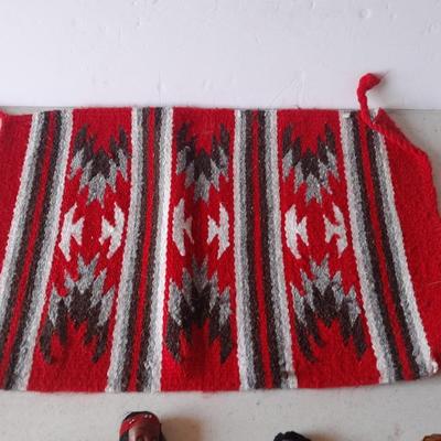 Signed pottery vase with Native dolls and Native. table throw rug