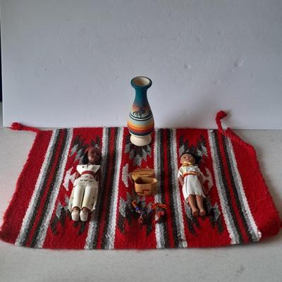 Signed pottery vase with Native dolls and Native. table throw rug