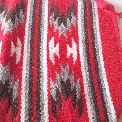 Signed pottery vase with Native dolls and Native. table throw rug