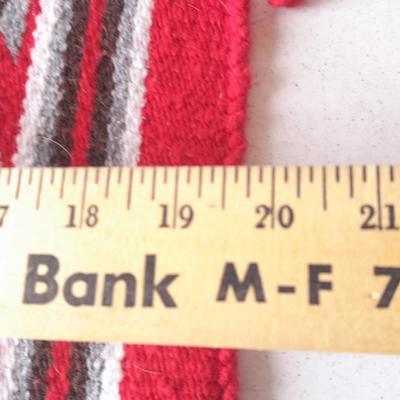 Signed pottery vase with Native dolls and Native. table throw rug