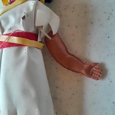 Signed pottery vase with Native dolls and Native. table throw rug