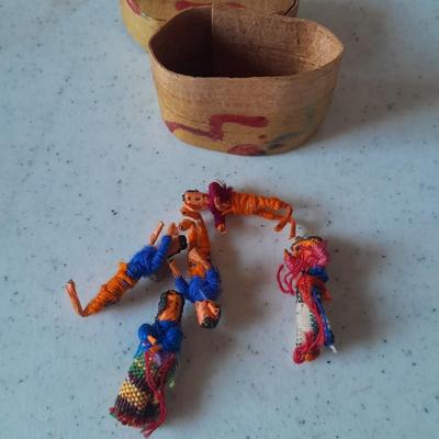 Signed pottery vase with Native dolls and Native. table throw rug