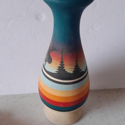 Signed pottery vase with Native dolls and Native. table throw rug