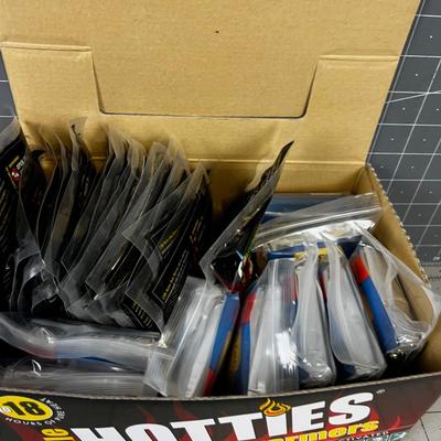 Box full of Space Blankets and Hotties Hand Warmers 