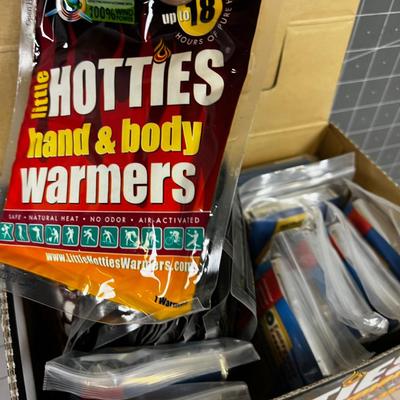 Box full of Space Blankets and Hotties Hand Warmers 