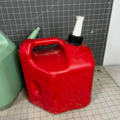 Green Plastic Watering Can and Gas Can