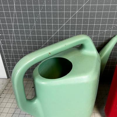 Green Plastic Watering Can and Gas Can