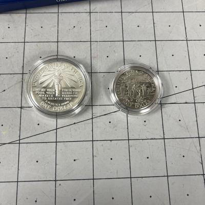 1986 Liberty Coin Set Dollar & Half Dollar. Both Depict the Statue of Liberty