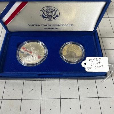 1986 Liberty Coin Set Dollar & Half Dollar. Both Depict the Statue of Liberty
