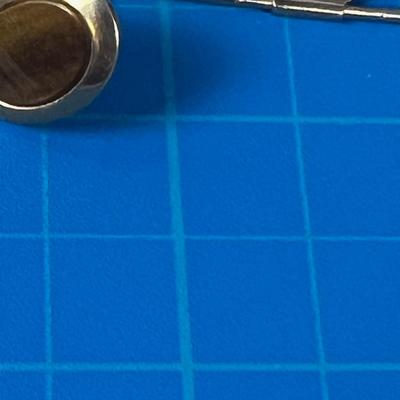 Small Pile of Men's Jewelry: Cuff Links and Tie Bars