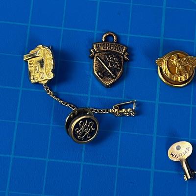 Pile of Lapel Pins: Eagle, Ogden High School, LDS 