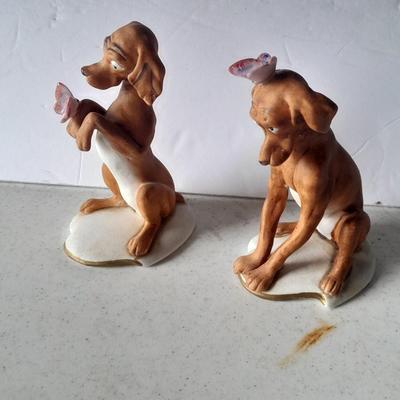 Two vintage hound dog with butterfly figures marked on base