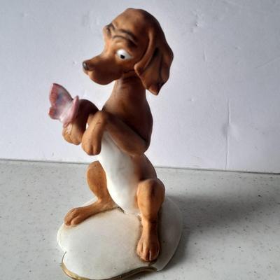 Two vintage hound dog with butterfly figures marked on base