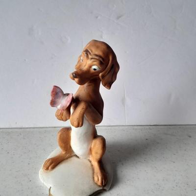 Two vintage hound dog with butterfly figures marked on base