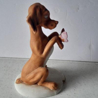 Two vintage hound dog with butterfly figures marked on base