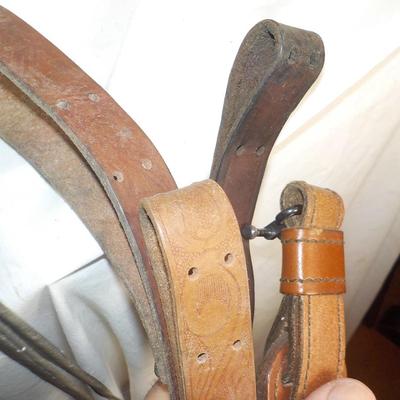 4 Adjustable leather rifle slings./ Est, $25 to $60.