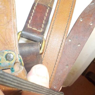 4 Adjustable leather rifle slings./ Est, $25 to $60.