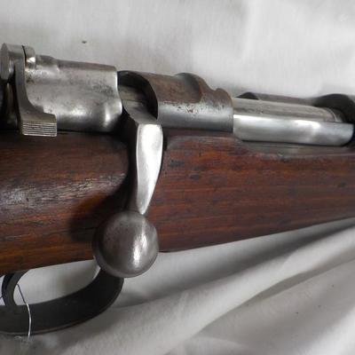 A Mauser 8mm rifle with manual sites. / est. $250 to $620.