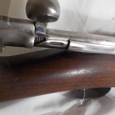 A Mauser 8mm rifle with manual sites. / est. $250 to $620.