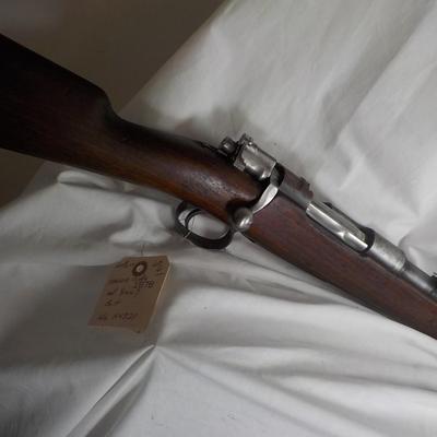 A Mauser 8mm rifle with manual sites. / est. $250 to $620.