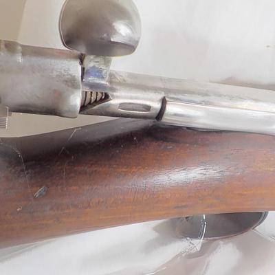 A Mauser 8mm rifle with manual sites. / est. $250 to $620.