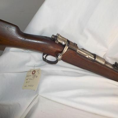 A Mauser 8mm rifle with manual sites. / est. $250 to $620.