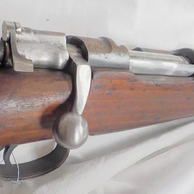 A Mauser 8mm rifle with manual sites. / est. $250 to $620.