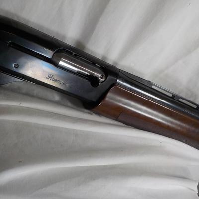 Famous Remington 11-87 Premiere Trap 12 gauge shot gun/ est $400 to $900.