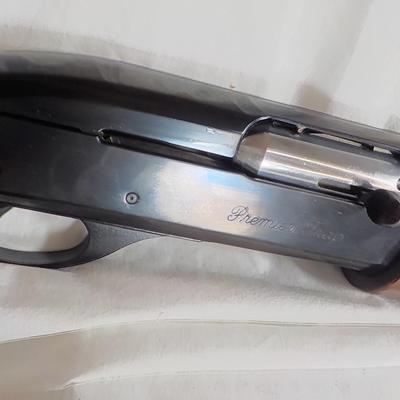 Famous Remington 11-87 Premiere Trap 12 gauge shot gun/ est $400 to $900.