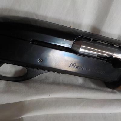 Famous Remington 11-87 Premiere Trap 12 gauge shot gun/ est $400 to $900.