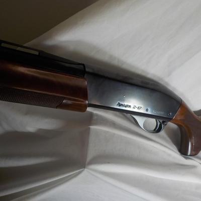 Famous Remington 11-87 Premiere Trap 12 gauge shot gun/ est $400 to $900.