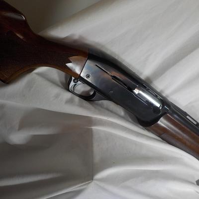 Famous Remington 11-87 Premiere Trap 12 gauge shot gun/ est $400 to $900.